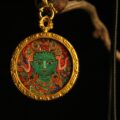 The "Empowered Tara": Green Tara Round Necklace | Courage & Vitality (Red Background) - Image 2